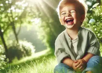 A child laughing with humor, positive motivational nature background. Green background.