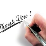 How Gratitude Can Help You Build a Positive Mindset 1 A person hand writing Thank you using Pen focusing on Gratitude to develop positive mindset.