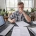 Man sitting at table with laptop